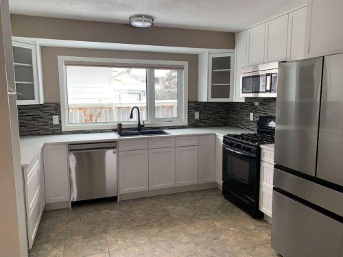 471 Dalmeny Hill Nw, Calgary, AB - Indoor Photo Showing Kitchen With Stainless Steel Kitchen With Double Sink With Upgraded Kitchen