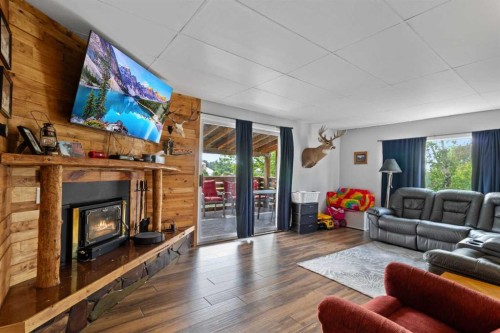 24 Main Street, Ardley, AB - Indoor Photo Showing Living Room With Fireplace