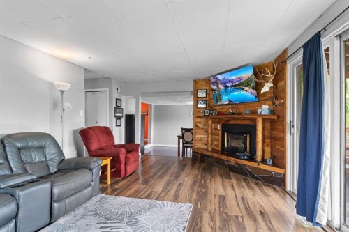 24 Main Street, Ardley, AB - Indoor Photo Showing Living Room With Fireplace