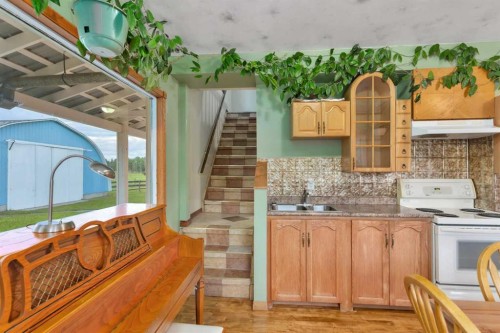 32328 Range Road 42, Rural Mountain View County, AB - Indoor Photo Showing Kitchen With Double Sink
