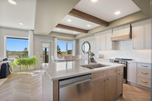 38 Springfield Boulevard, Sylvan Lake, AB - Indoor Photo Showing Kitchen With Double Sink With Upgraded Kitchen