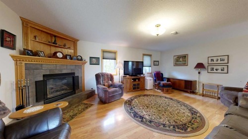 18320 Twp 39-0, Botha, AB - Indoor Photo Showing Living Room With Fireplace