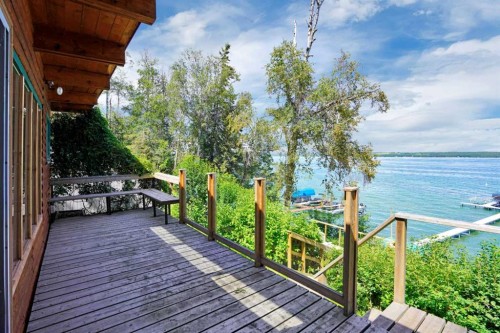 57 Grand Avenue, Norglenwold, AB - Outdoor With Body Of Water With Deck Patio Veranda