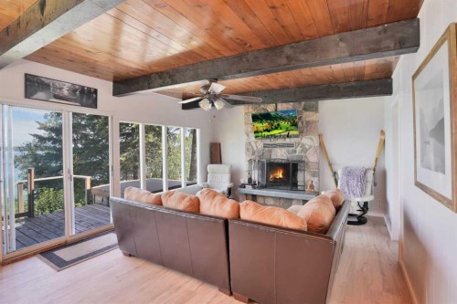57 Grand Avenue, Norglenwold, AB - Indoor Photo Showing Living Room With Fireplace