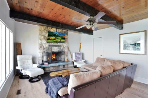 57 Grand Avenue, Norglenwold, AB - Indoor Photo Showing Living Room With Fireplace