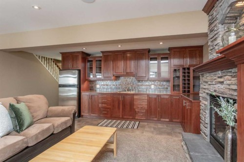 217-27111 Highway 597, Rural Lacombe County, AB - Indoor Photo Showing Kitchen With Fireplace