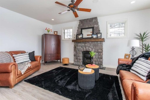 217-27111 Highway 597, Rural Lacombe County, AB - Indoor Photo Showing Living Room With Fireplace
