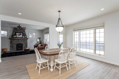217-27111 Highway 597, Rural Lacombe County, AB - Indoor Photo Showing Dining Room With Fireplace