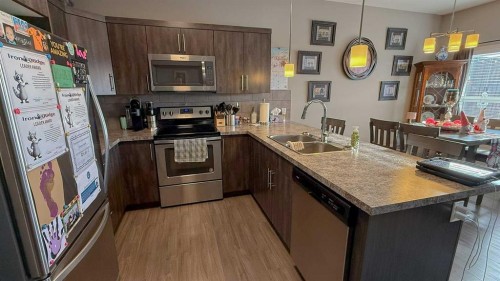 1-13 Athens Road, Blackfalds, AB - Indoor Photo Showing Kitchen With Double Sink