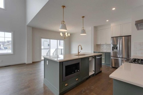 21 Bayview Mews Sw, Airdrie, AB - Indoor Photo Showing Kitchen With Stainless Steel Kitchen With Upgraded Kitchen