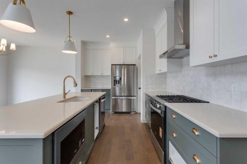 21 Bayview Mews Sw, Airdrie, AB - Indoor Photo Showing Kitchen With Stainless Steel Kitchen With Upgraded Kitchen