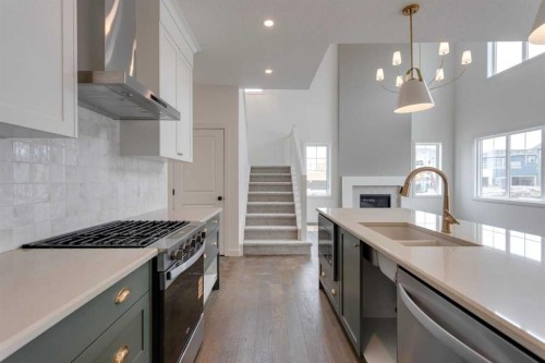 21 Bayview Mews Sw, Airdrie, AB - Indoor Photo Showing Kitchen With Double Sink With Upgraded Kitchen