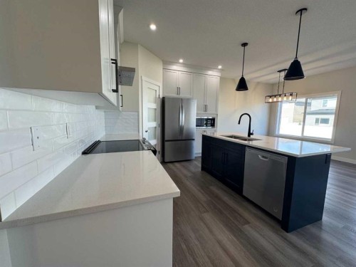 49 Emmett Crescent, Red Deer, AB - Indoor Photo Showing Kitchen With Stainless Steel Kitchen With Double Sink With Upgraded Kitchen