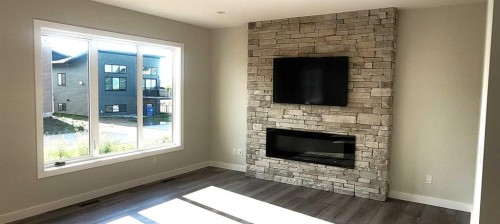 49 Emmett Crescent, Red Deer, AB - Indoor Photo Showing Living Room With Fireplace