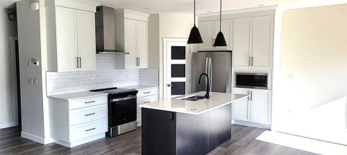 49 Emmett Crescent, Red Deer, AB - Indoor Photo Showing Kitchen With Double Sink With Upgraded Kitchen