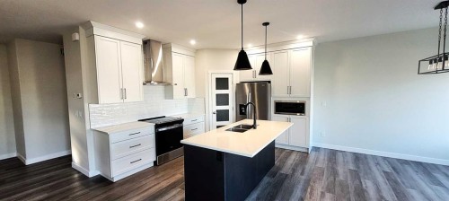 49 Emmett Crescent, Red Deer, AB - Indoor Photo Showing Kitchen With Double Sink With Upgraded Kitchen