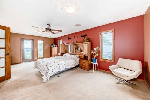 9 Rustic Road, Norglenwold, AB - Indoor Photo Showing Bedroom