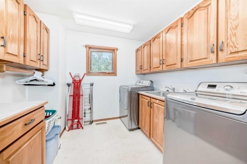 9 Rustic Road, Norglenwold, AB - Indoor Photo Showing Laundry Room