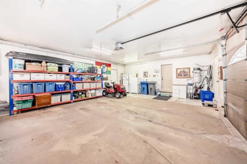 9 Rustic Road, Norglenwold, AB - Indoor Photo Showing Garage