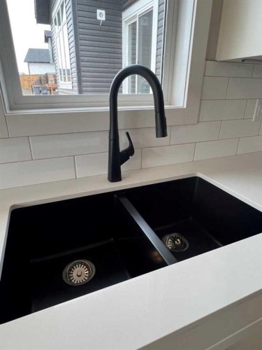 5 Gray Close, Sylvan Lake, AB - Indoor Photo Showing Kitchen With Double Sink