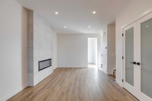 8546 Huxbury Drive Ne, Calgary, AB - Indoor With Fireplace