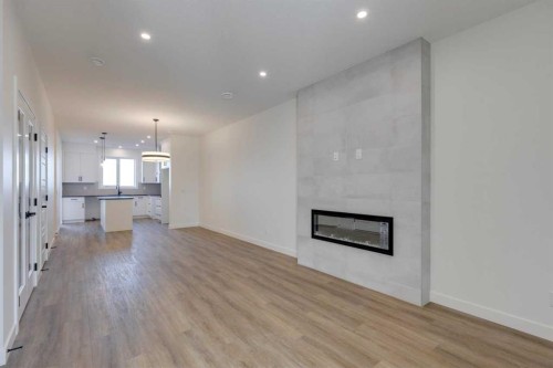 8546 Huxbury Drive Ne, Calgary, AB - Indoor Photo Showing Living Room With Fireplace