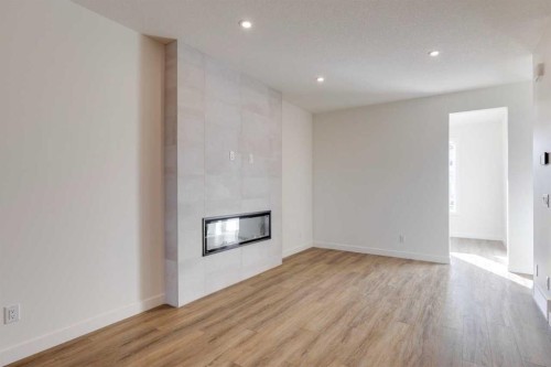 8546 Huxbury Drive Ne, Calgary, AB - Indoor With Fireplace