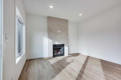 13 Aztec Street, Blackfalds, AB - Indoor Photo Showing Living Room With Fireplace