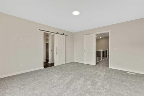 3 Heritage Link, Cochrane, AB - Indoor Photo Showing Other Room