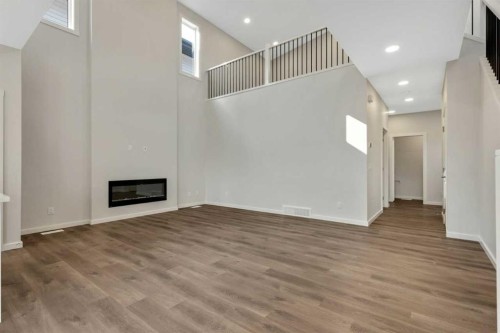 3 Heritage Link, Cochrane, AB - Indoor With Fireplace