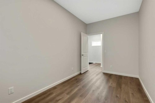 3 Heritage Link, Cochrane, AB - Indoor Photo Showing Other Room