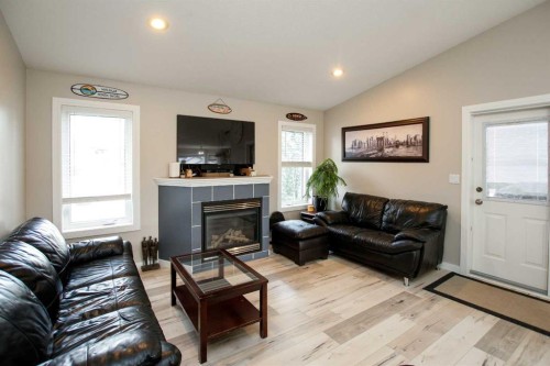 107 Ackerman Crescent, Red Deer, AB - Indoor Photo Showing Living Room With Fireplace