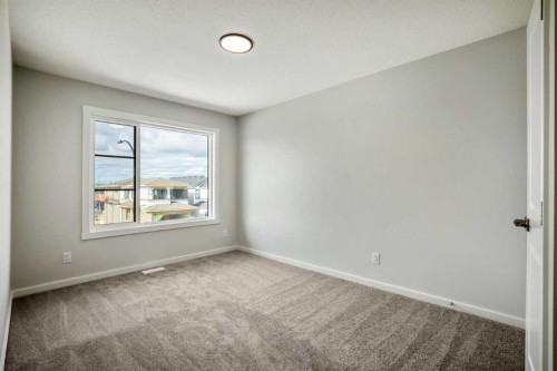 27 Heritage Link, Cochrane, AB - Indoor Photo Showing Other Room
