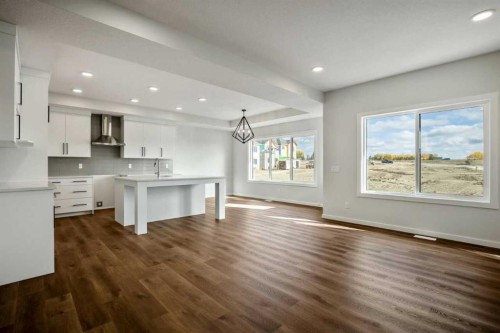 27 Heritage Link, Cochrane, AB - Indoor Photo Showing Kitchen With Upgraded Kitchen