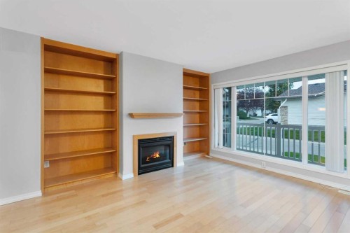 10-73 Addington Drive, Red Deer, AB - Indoor Photo Showing Living Room With Fireplace