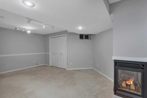 10-73 Addington Drive, Red Deer, AB - Indoor With Fireplace