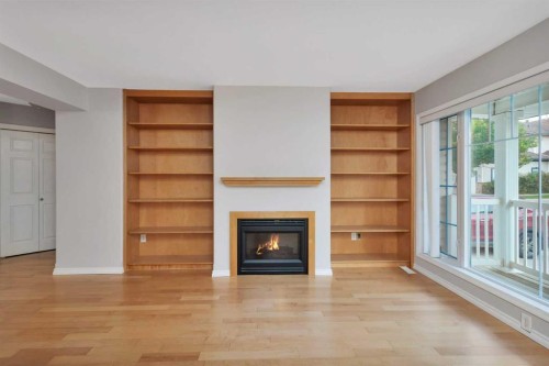 10-73 Addington Drive, Red Deer, AB - Indoor Photo Showing Living Room With Fireplace