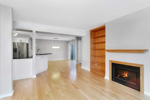 10-73 Addington Drive, Red Deer, AB - Indoor Photo Showing Living Room With Fireplace