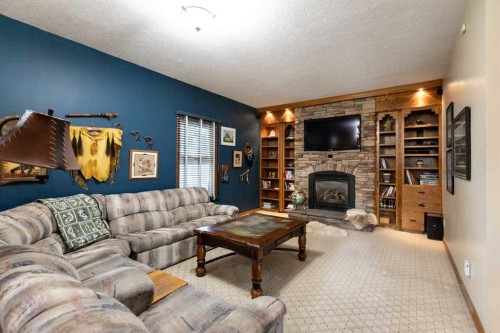 128 Norby Crescent, Red Deer, AB - Indoor Photo Showing Living Room With Fireplace
