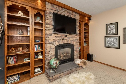 128 Norby Crescent, Red Deer, AB - Indoor With Fireplace