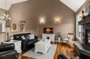 48 Fieldstone Way, Sylvan Lake, AB  - Indoor Photo Showing Living Room With Fireplace 