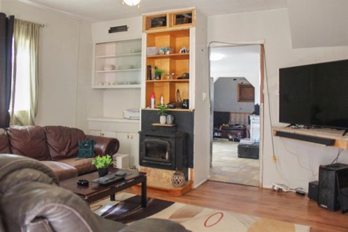 4801 51 Street, Sedgewick, AB - Indoor Photo Showing Living Room With Fireplace