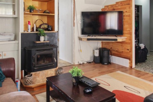 4801 51 Street, Sedgewick, AB - Indoor Photo Showing Living Room With Fireplace