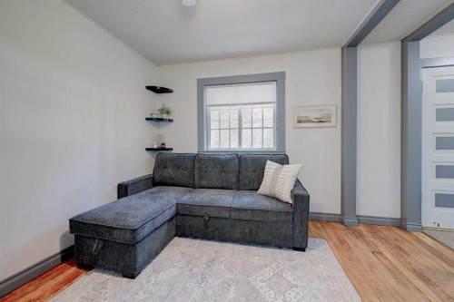 4738 50 Street East, Sylvan Lake, AB - Indoor Photo Showing Living Room With Fireplace