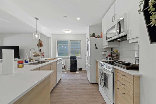 2311 16 Street Sw, Calgary, AB - Indoor Photo Showing Kitchen With Double Sink With Upgraded Kitchen