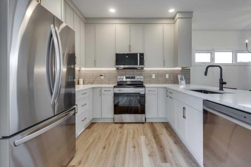 56 Emmett Crescent, Red Deer, AB - Indoor Photo Showing Kitchen With Upgraded Kitchen