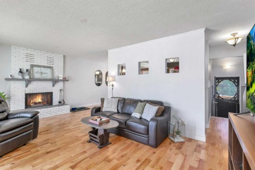 404 3 Avenue Sw, Sundre, AB - Indoor Photo Showing Living Room With Fireplace