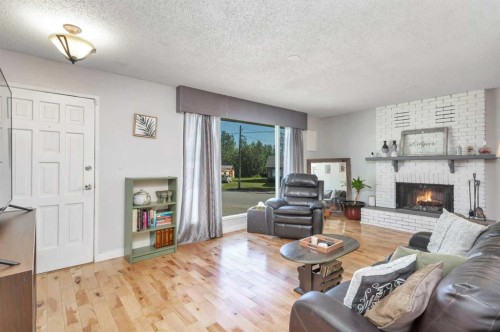 404 3 Avenue Sw, Sundre, AB - Indoor Photo Showing Living Room With Fireplace