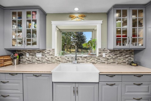 33 Fairway Drive, Lacombe, AB - Indoor Photo Showing Kitchen With Double Sink