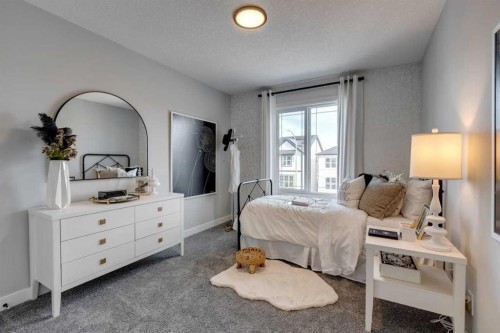 401 Sora Way Se, Calgary, AB - Indoor Photo Showing Bedroom